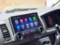 A 10.1-inch motor vehicle A/V player with dual knob control installed in a vehicle's dashboard, featuring a touchscreen interface displaying icons for Apple CarPlay and Android Auto.