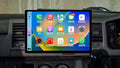 A 13.3-inch GPS Bluetooth wireless stereo radio interface displayed inside a vehicle's dashboard, compatible with Apple Carplay and Android Auto.