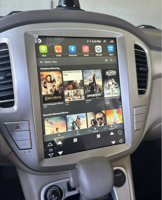 A 9.7-inch vertical screen GPS wireless stereo radio installed in a vehicle's dashboard, displaying a interface with various app icons and a search bar.