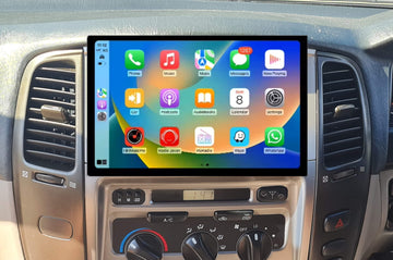 A 13.3-inch touchscreen car stereo installation in a vehicle's dashboard, displaying a colorful interface with icons for Apple CarPlay and Android Auto features.