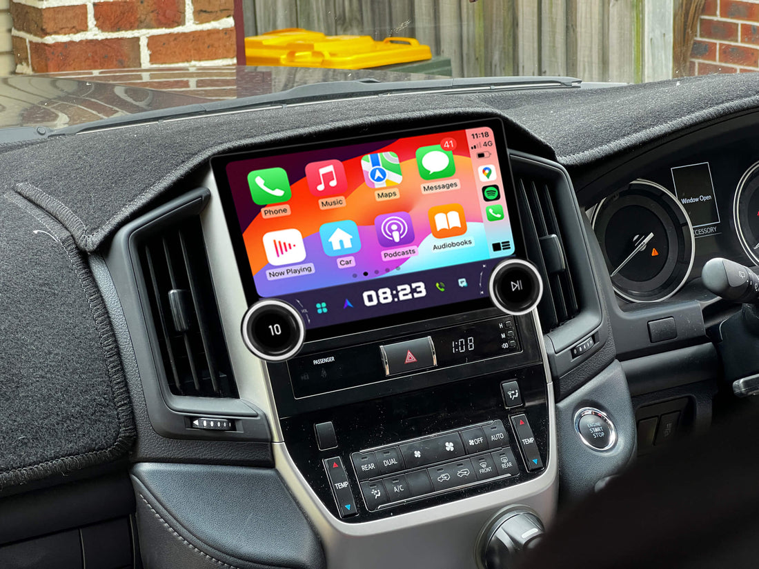 An aftermarket GPS touchscreen stereo system installed in the dashboard of a vehicle, displaying a colorful interface compatible with Apple CarPlay and Android Auto.