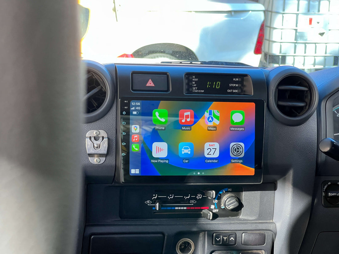 An in-dash car audio and visual system with a touchscreen display, installed in a vehicle's dashboard.