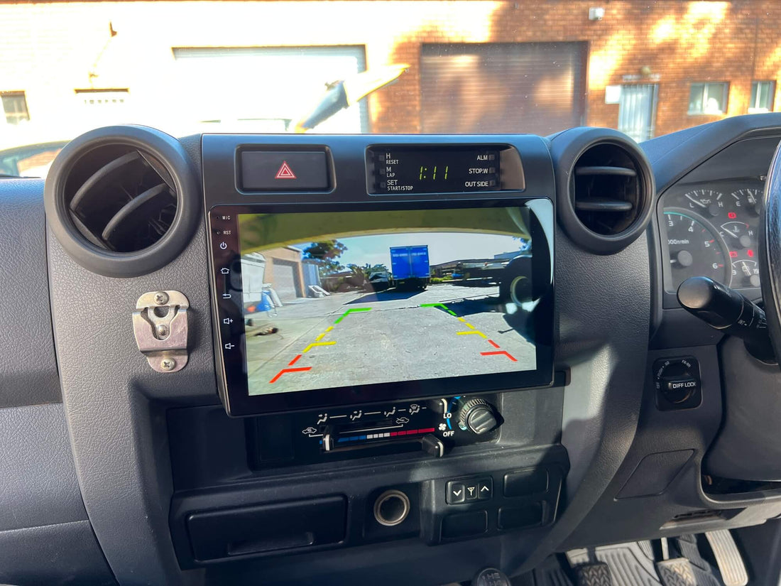 An in-dash car audio and visual system with a touchscreen display, installed in a vehicle's dashboard.