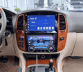 A 15.8-inch touchscreen car stereo system installed in the center of a vehicle's dashboard, displaying a blue interface screen.