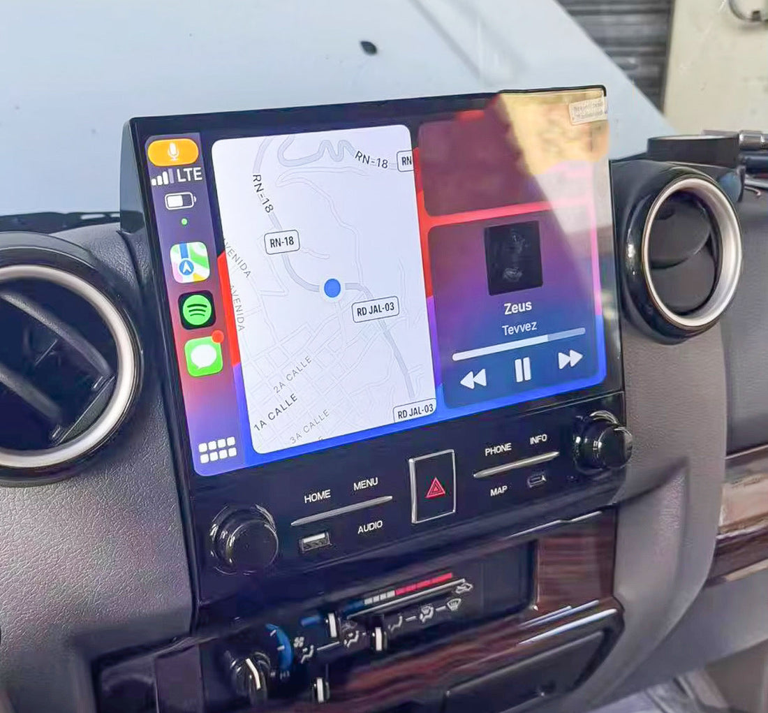 An 11.6 inch Tesla style touchscreen installed in a vehicle's dashboard, displaying a map and various controls.