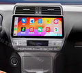 A 10.25 inch touchscreen car stereo system installed in a vehicle's dashboard, displaying a colorful interface with various app icons, and integrated with the car's steering wheel control.