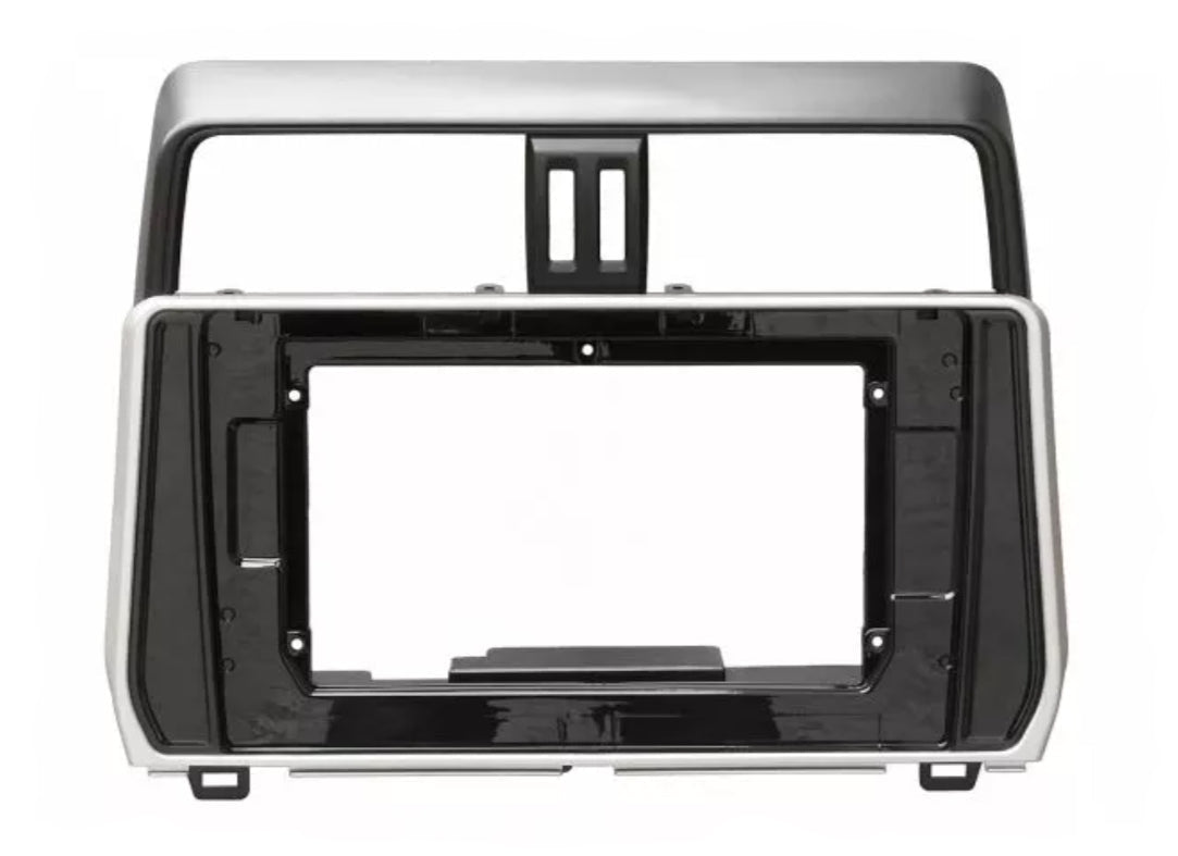 A Toyota Prado 2017-2025 150 Series stereo facia suitable for both 10 inch android and 7 inch Double din, made of black ABS plastic with mounting brackets.