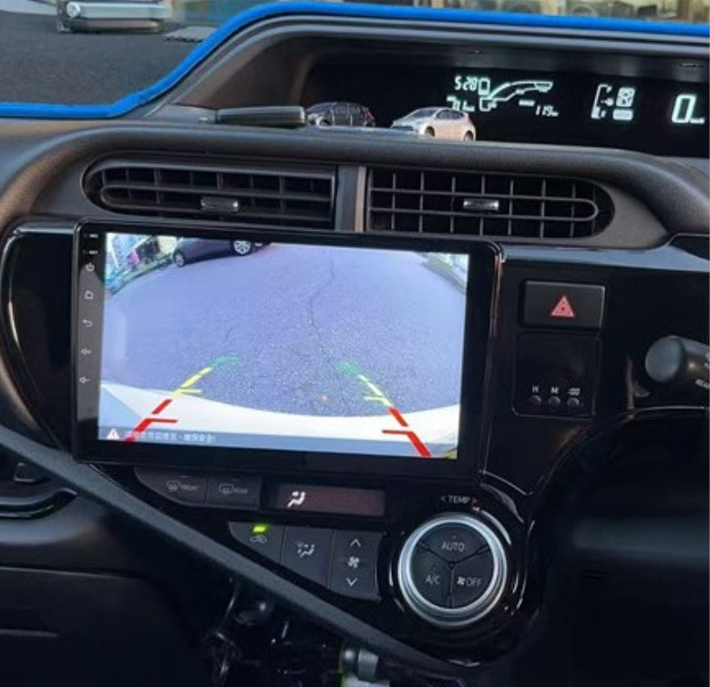 A black motor vehicle in-dash system with a touchscreen displaying Apple CarPlay interface, intended for Toyota Prius C 2012-2019 models.